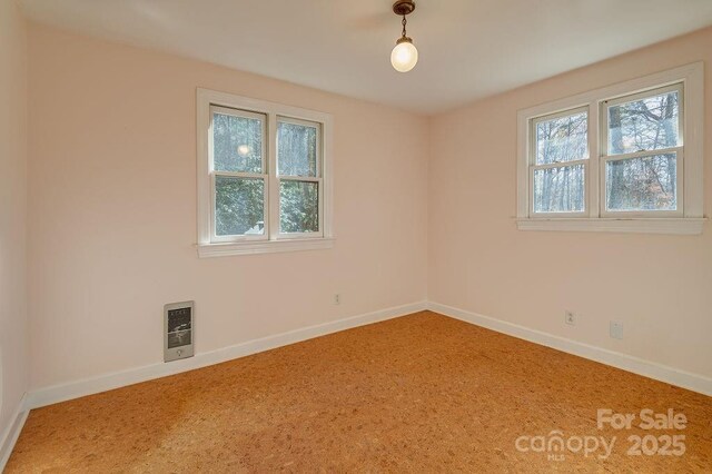 14 Woods Rd, Fairview, NC 28730 - carpeted empty room with baseboards and heating unit