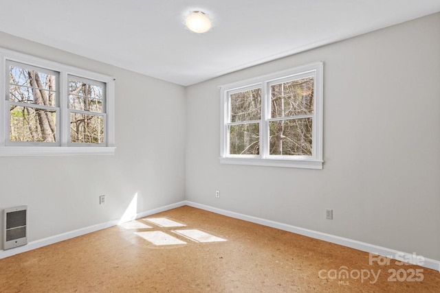 14 Woods Rd, Fairview, NC 28730 - carpeted empty room with plenty of natural light and heating unit