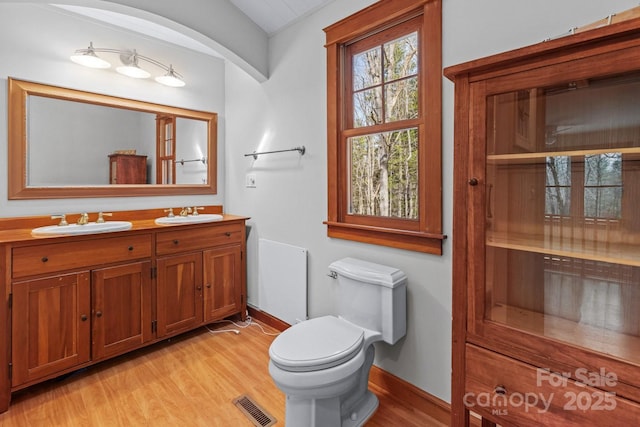 14 Woods Rd, Fairview, NC 28730 - bathroom featuring wood finished floors and double vanity