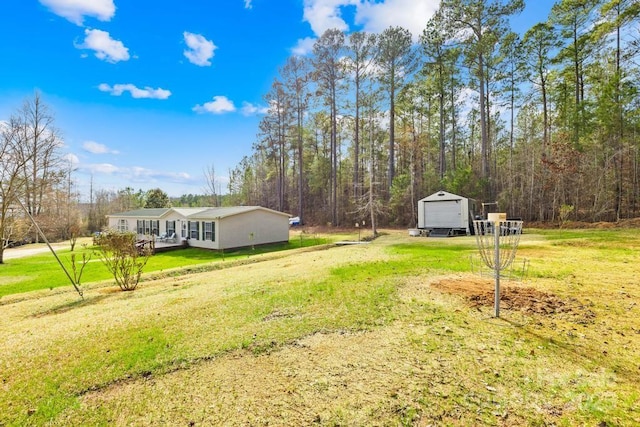 view of yard featuring covered porch and a garage