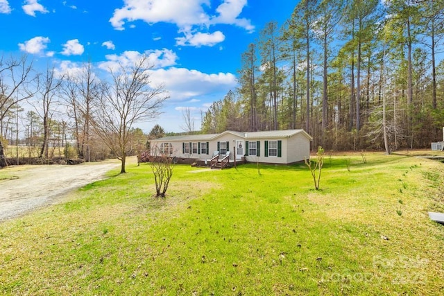 ranch-style home with a front yard