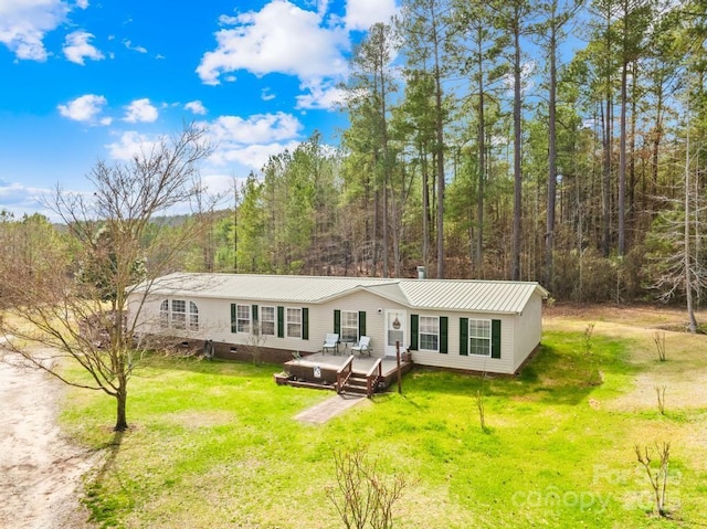 view of front of house with a wooden deck and a front yard