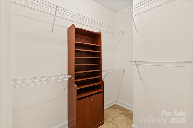 walk in closet with visible vents