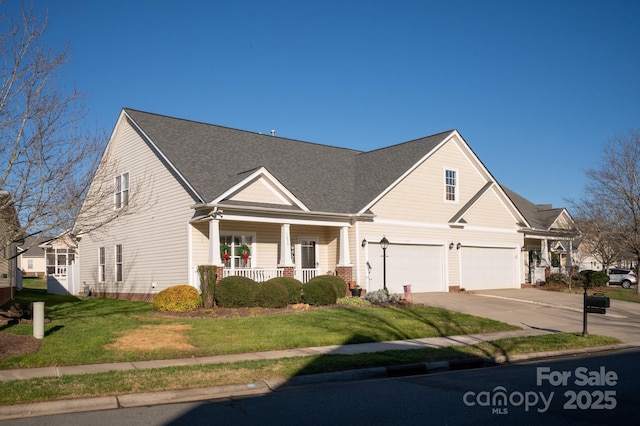 view of front facade featuring driveway, covered porch, a garage, and a front lawn