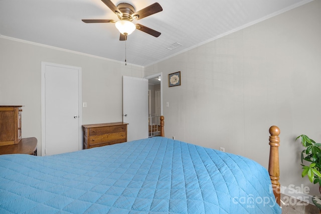 bedroom with ceiling fan, visible vents, and crown molding