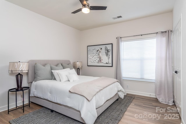 bedroom featuring hardwood / wood-style flooring and ceiling fan