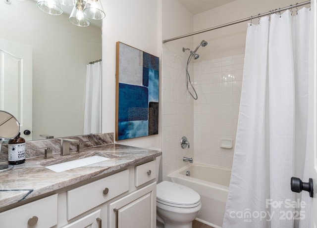 full bathroom with shower / tub combo, vanity, and toilet