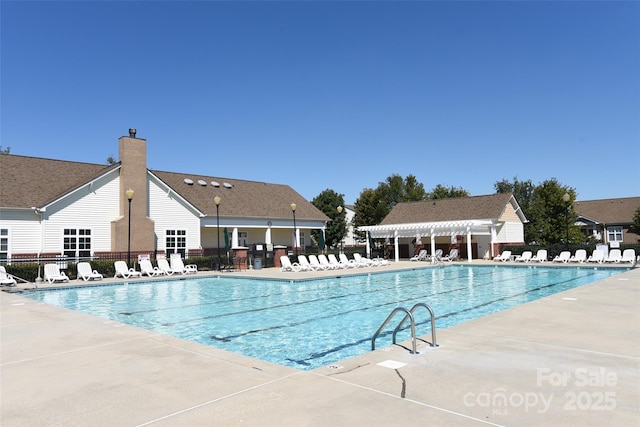 view of pool featuring a pergola and a patio area