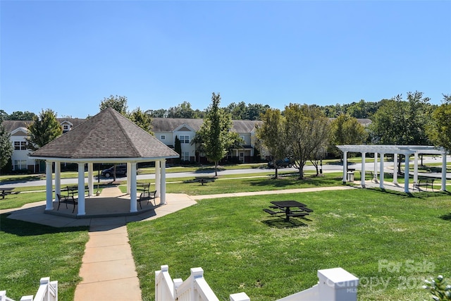 surrounding community featuring a gazebo, a yard, and a pergola