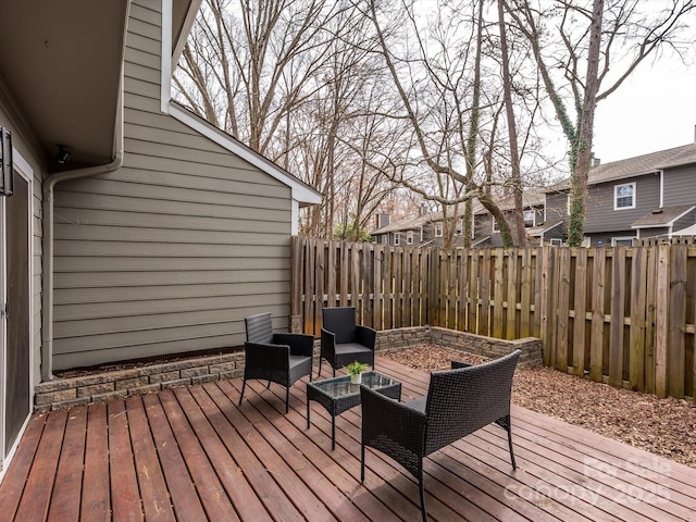 deck featuring a fenced backyard and a residential view