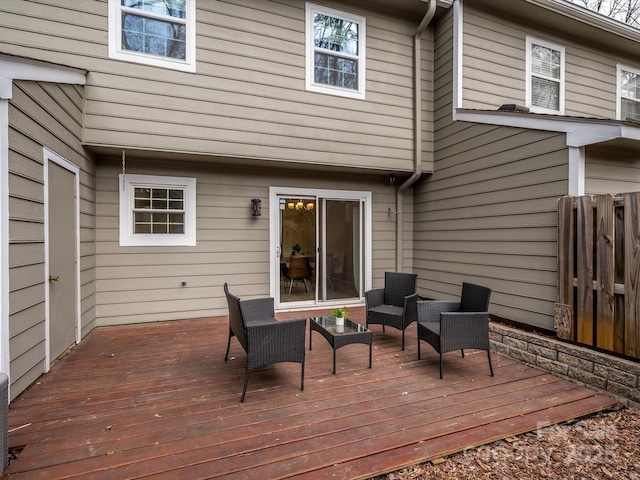 wooden terrace featuring outdoor lounge area