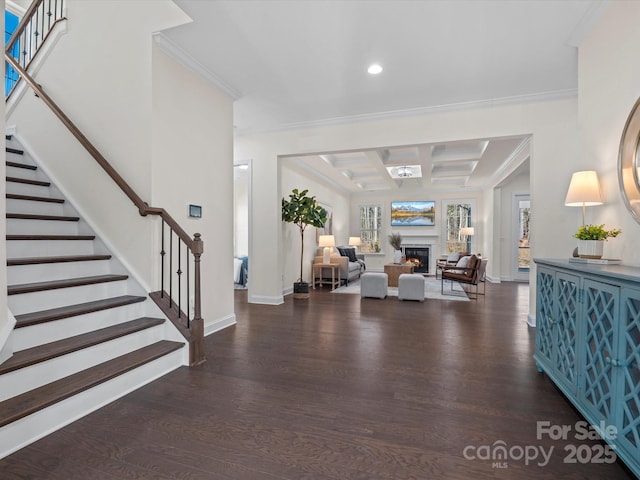 entryway featuring stairway, coffered ceiling, and wood finished floors