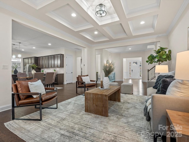 living room with coffered ceiling, wood finished floors, beam ceiling, and an inviting chandelier