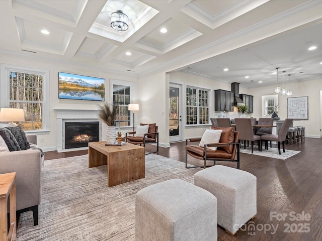 living area with dark wood-style floors, beam ceiling, coffered ceiling, and a notable chandelier