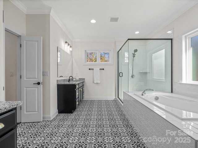 bathroom featuring a garden tub, crown molding, vanity, a shower stall, and baseboards