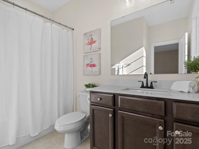 full bathroom featuring toilet, tile patterned floors, curtained shower, and vanity