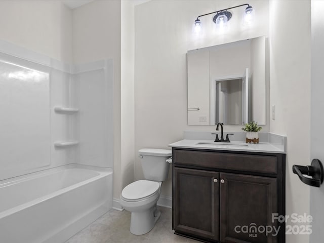 bathroom featuring tile patterned floors, vanity, toilet, and baseboards