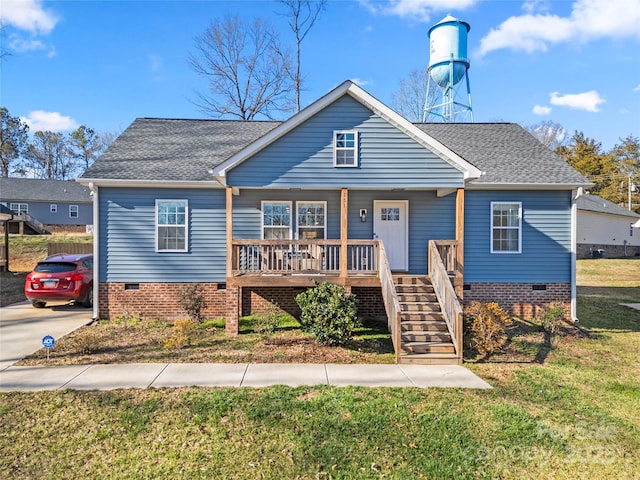 view of front of home featuring covered porch and a front lawn