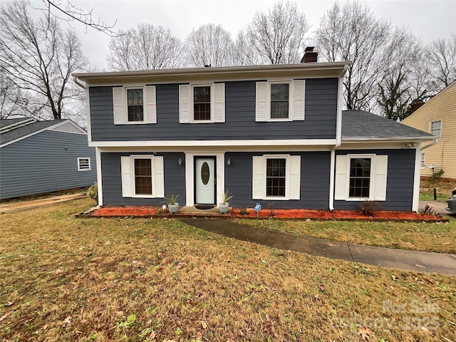 4922 Rivergreen Ln, Charlotte, NC 28227 - view of front of home with a chimney and a front lawn