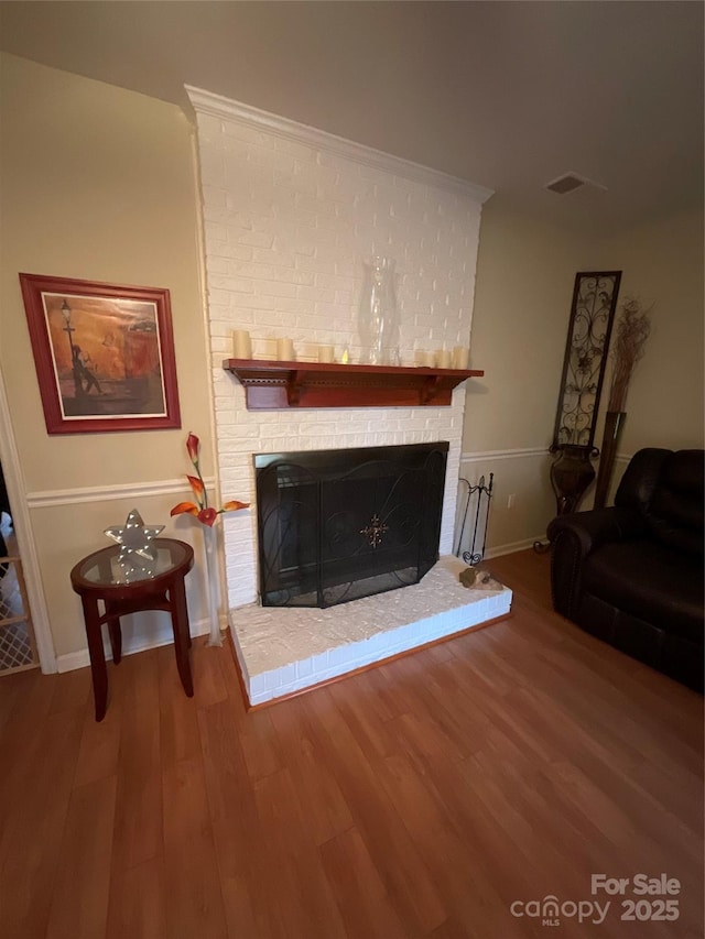 4922 Rivergreen Ln, Charlotte, NC 28227 - living room featuring a fireplace, wood finished floors, visible vents, and baseboards