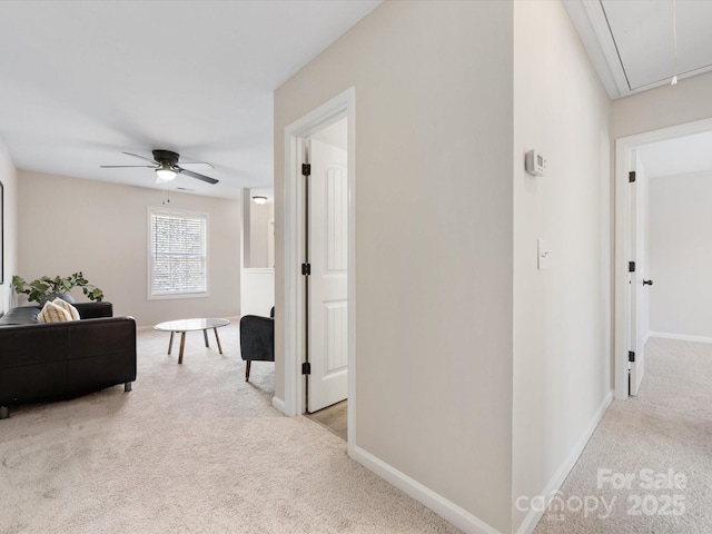 corridor featuring light colored carpet