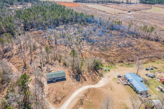 birds eye view of property featuring a rural view