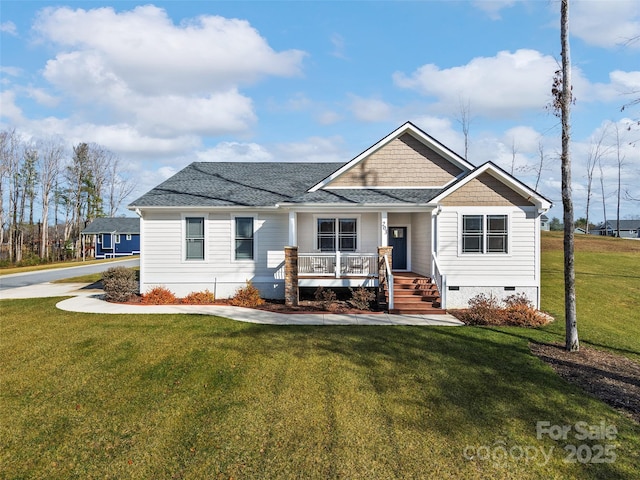 view of front of property featuring a front yard and covered porch