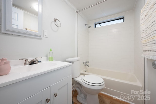 full bathroom with toilet, wood finished floors, vanity, and bathing tub / shower combination