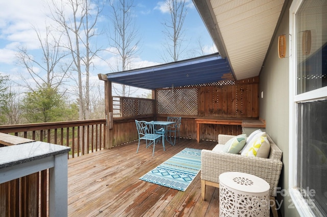 deck featuring outdoor dining area