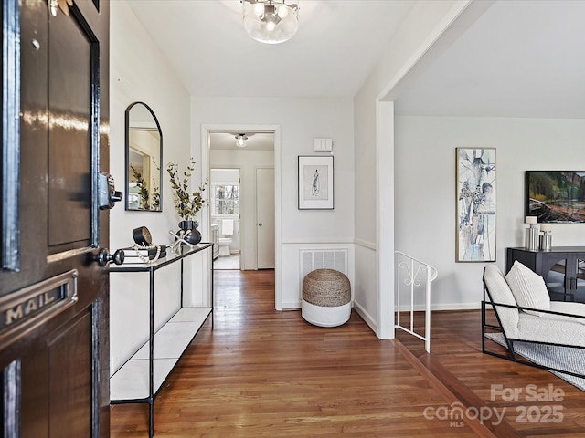 foyer entrance with dark hardwood / wood-style floors