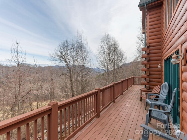 wooden deck featuring a mountain view