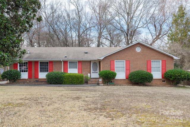 single story home featuring entry steps, crawl space, and brick siding