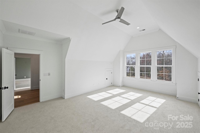 bonus room with lofted ceiling, carpet flooring, visible vents, and a ceiling fan