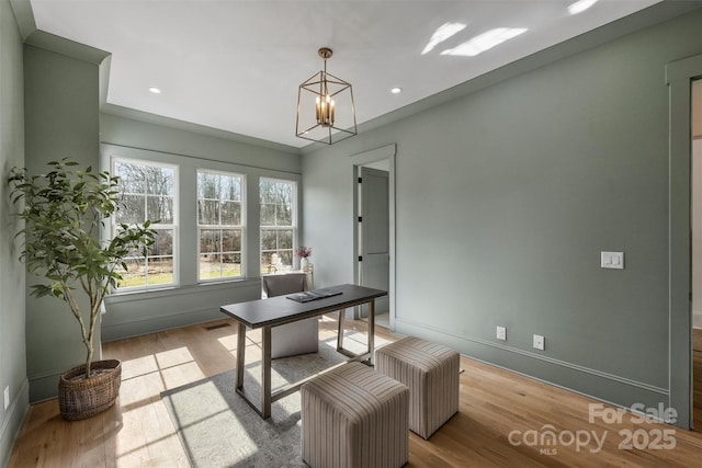 office space with a chandelier, recessed lighting, wood finished floors, and baseboards