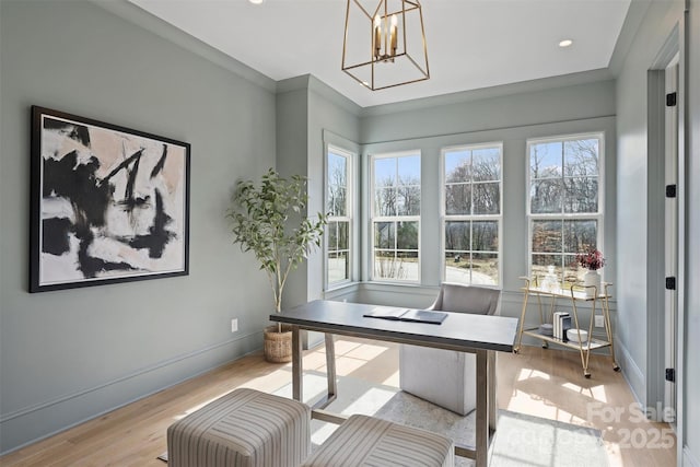 home office with light wood-style flooring, recessed lighting, baseboards, an inviting chandelier, and crown molding