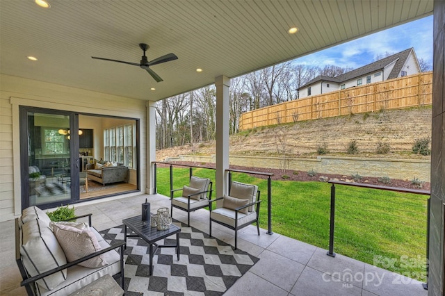 view of patio / terrace with a ceiling fan, fence, and an outdoor hangout area