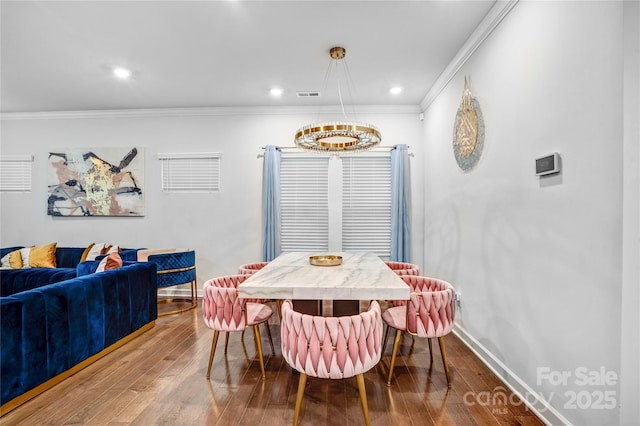 dining space with recessed lighting, wood finished floors, visible vents, baseboards, and crown molding