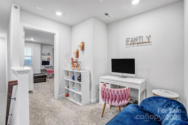 office space with baseboards, recessed lighting, visible vents, and light colored carpet