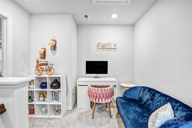 interior space featuring baseboards, visible vents, and light colored carpet