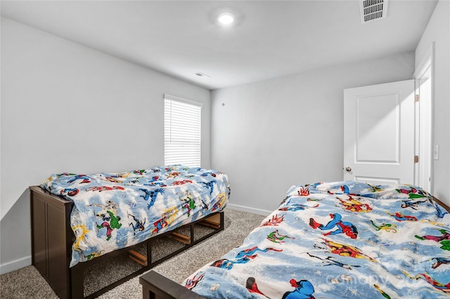 carpeted bedroom with visible vents and baseboards