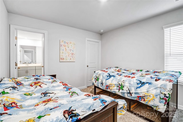 carpeted bedroom with visible vents and baseboards