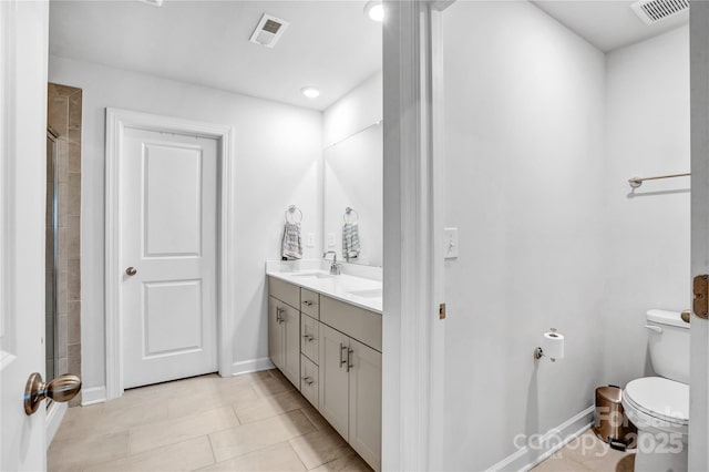 full bathroom featuring toilet, baseboards, visible vents, and a sink