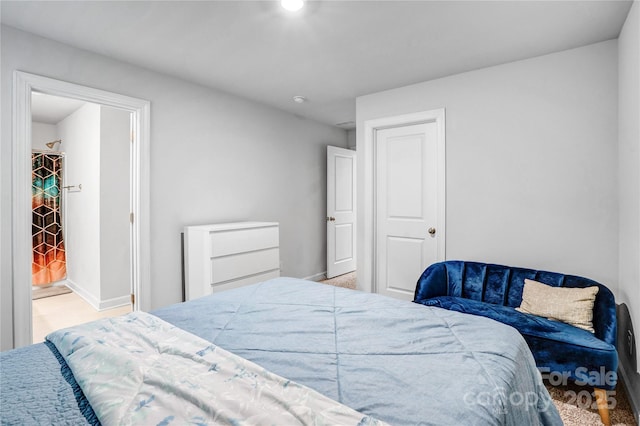 bedroom featuring baseboards