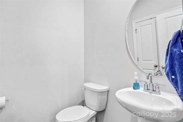 bathroom with a sink and toilet