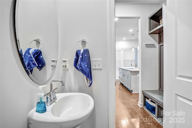 full bath with vanity and wood finished floors