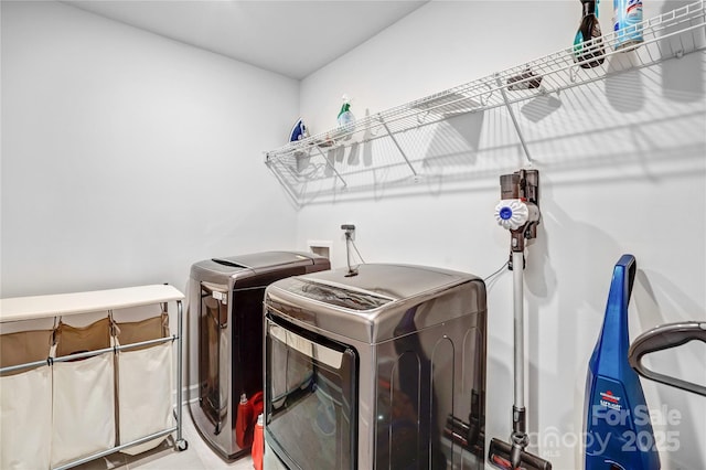 washroom with laundry area and washer and dryer