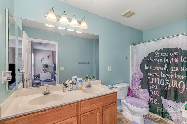 ensuite bathroom featuring connected bathroom, visible vents, a sink, and toilet