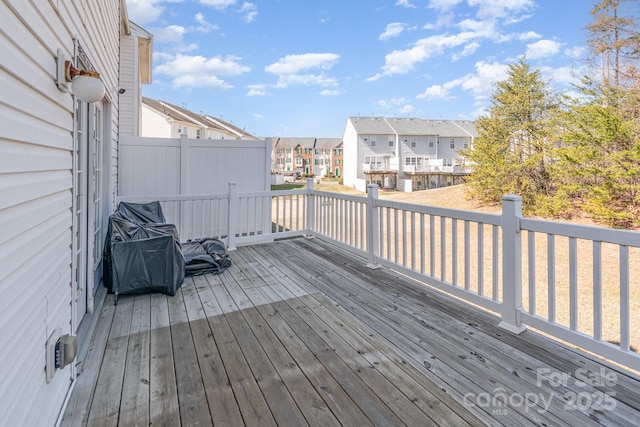 wooden deck featuring a residential view