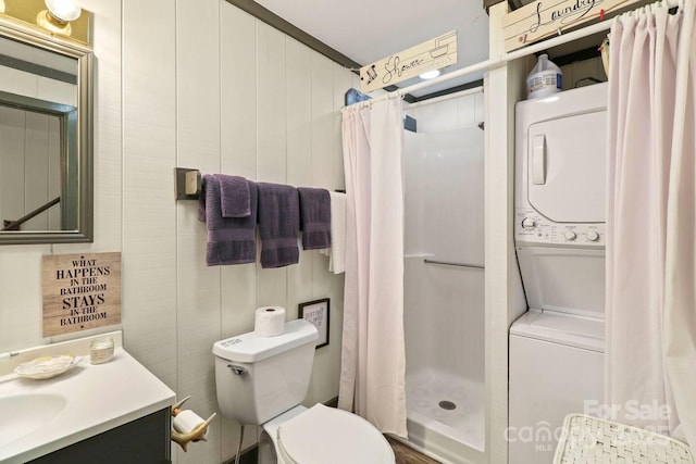 bathroom featuring stacked washing maching and dryer, vanity, toilet, and a shower with curtain