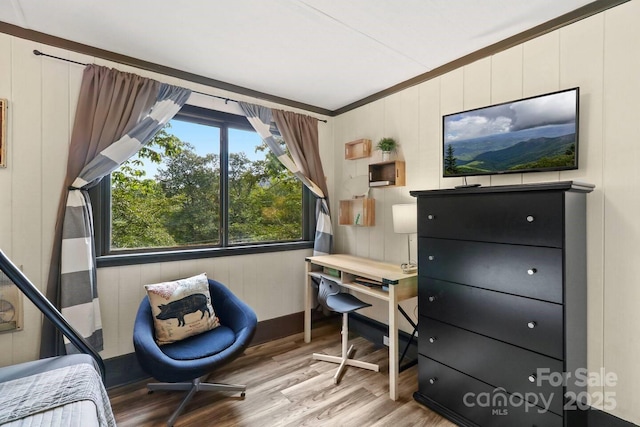 bedroom featuring crown molding and wood-type flooring